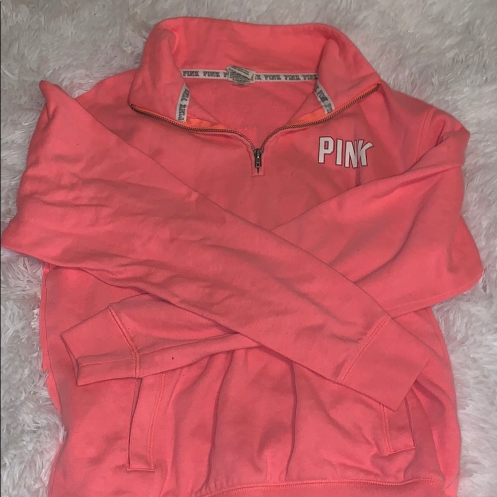 A bright pink sweatshirt